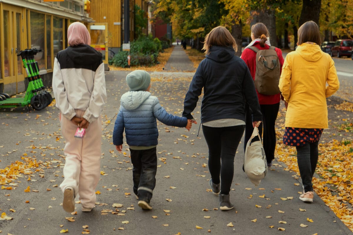 Kids are walking together with parents